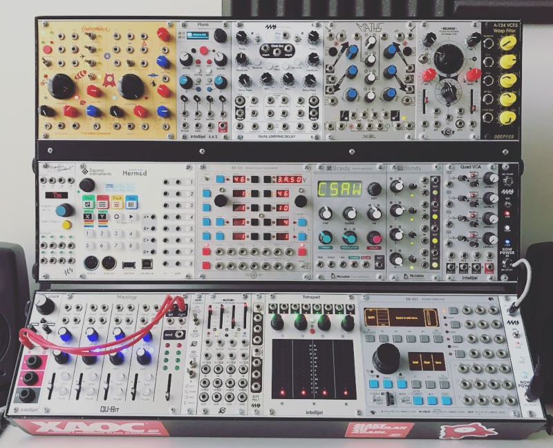 A Eurorack modular synthesizer. The different modules designs and logos reflect the adoption of the Eurorack standard which makes modules from different manufacturers interoperable. Image © Paul Anthony/CC-BY-SA-4.0.